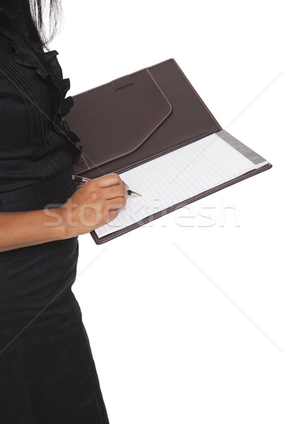 Businesswoman - Latina writing in notepad closeup Stock photo © dgilder