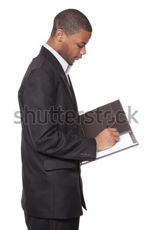 Africano americano empresário isolado branco escrita bloco de notas Foto stock © dgilder