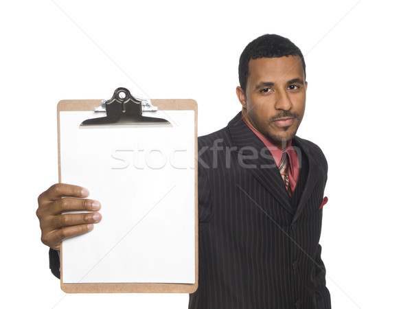 Empresário clipboard isolado africano americano olhando Foto stock © dgilder