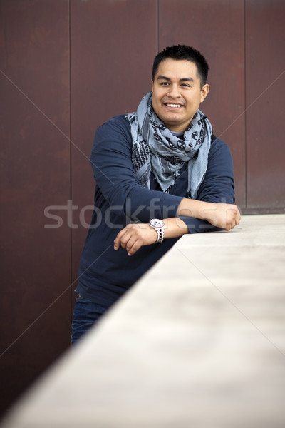 Hispanic Man - Leaning on wall Stock photo © dgilder