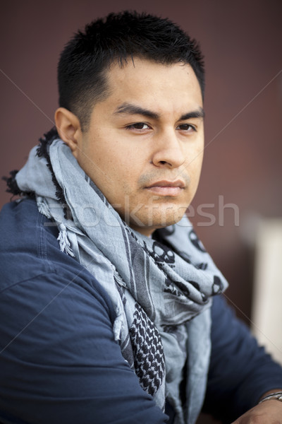 Hispanic Man - Leaning on wall Stock photo © dgilder