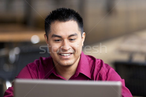 Stock photo: Hispanic Businessman - Telecommuting from Internet Cafe