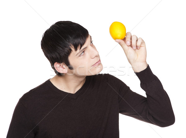 Caucasian man examining a lemon Stock photo © dgilder
