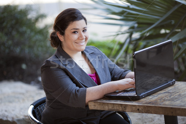Businesswoman - Telecommuting from Internet Cafe Stock photo © dgilder