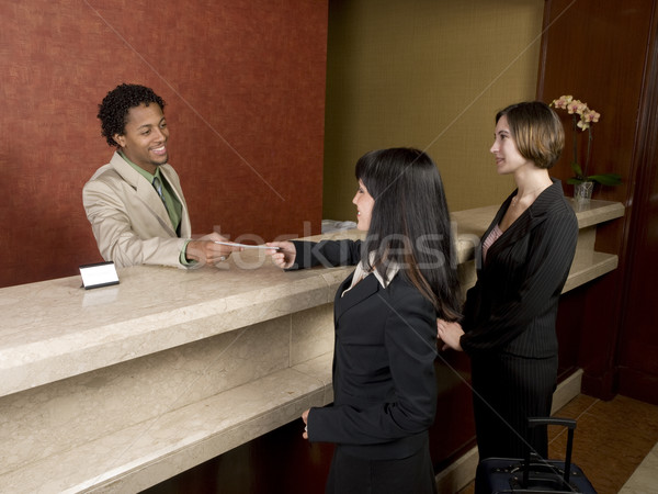 Hotel business werknemer glimlach man zakenman Stockfoto © dgilder