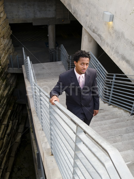 serious businessman on stairs Stock photo © dgilder