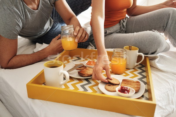 Stock photo: Happy Husband And Wife Eating Breakfast In Bed