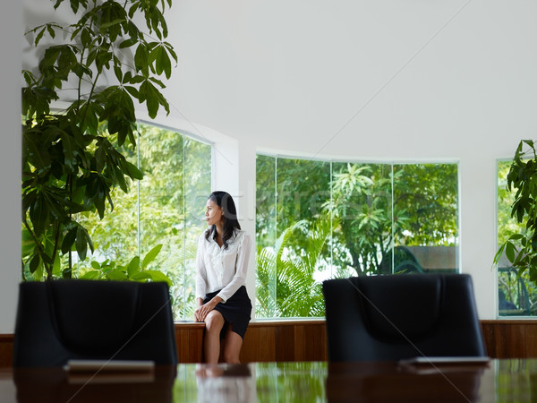 businesswoman contemplating out of window in meeting room Stock photo © diego_cervo