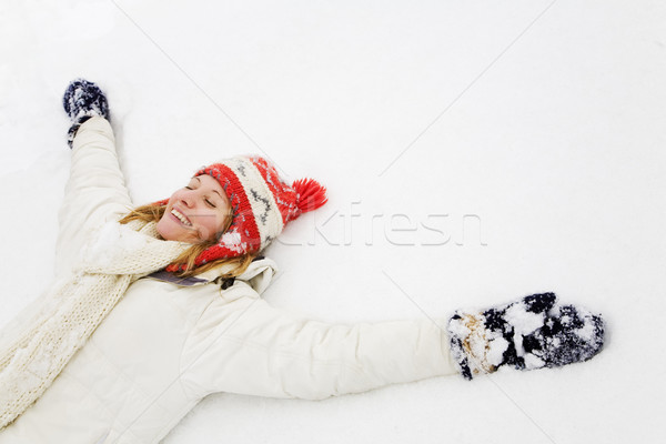 Téli tájkép szőke lány fekszik hó copy space Stock fotó © diego_cervo