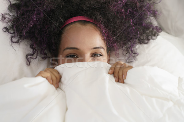 Beautiful Happy Hispanic Teen Waking Up And Smiling Undercover Stock photo © diego_cervo