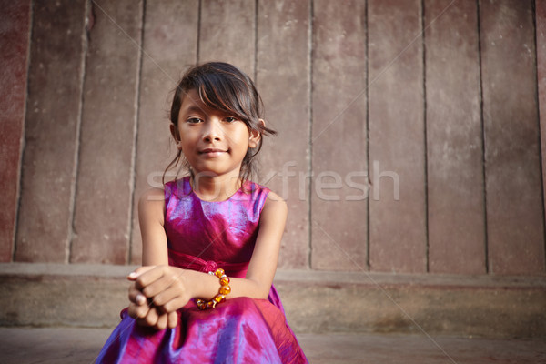 Stock photo: Cute and happy little Asian girl smiling at camera