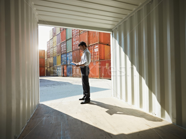 business man with shipping containers Stock photo © diego_cervo