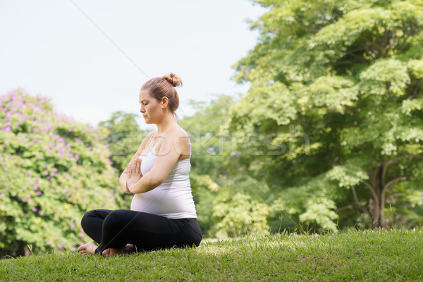 pregnant woman mother belly relaxing park yoga prayer Stock photo © diego_cervo