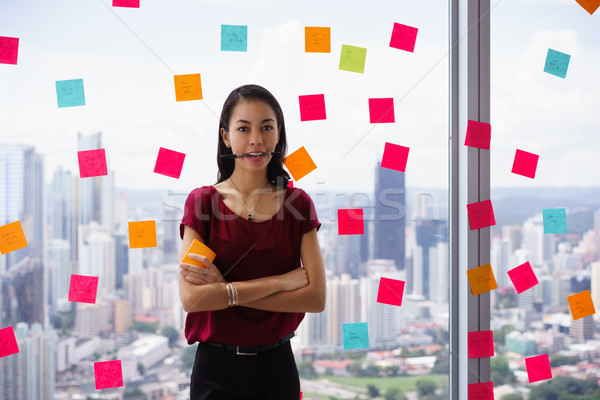 Busy Business Woman With Pen In Mouth And Adhesive Notes Stock photo © diego_cervo