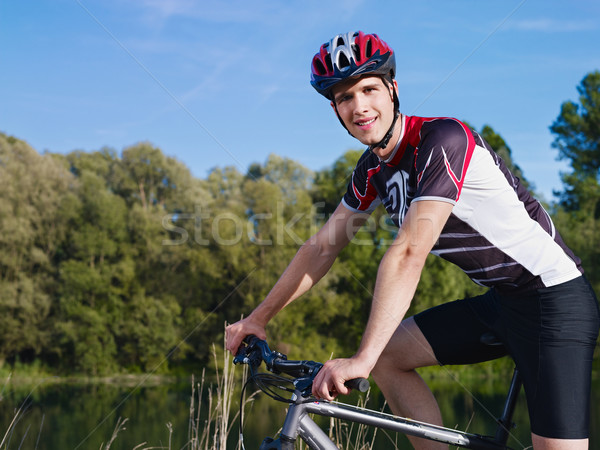 Moço treinamento mountain bike esportes atividade Foto stock © diego_cervo