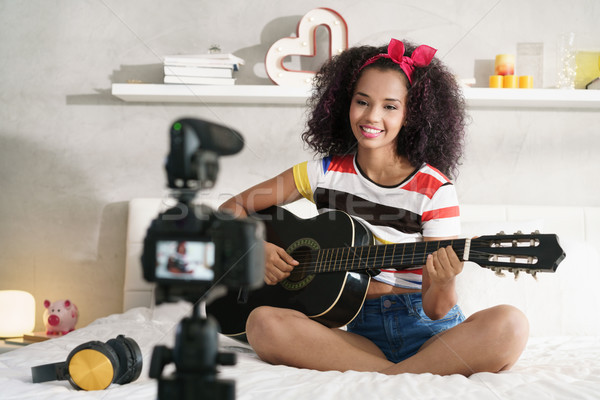 Stock photo: Woman Girving Guitar Class On Internet With Video Tutorial