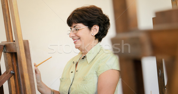 Kıdemli kadın öğrenme boya sanat ders Stok fotoğraf © diego_cervo