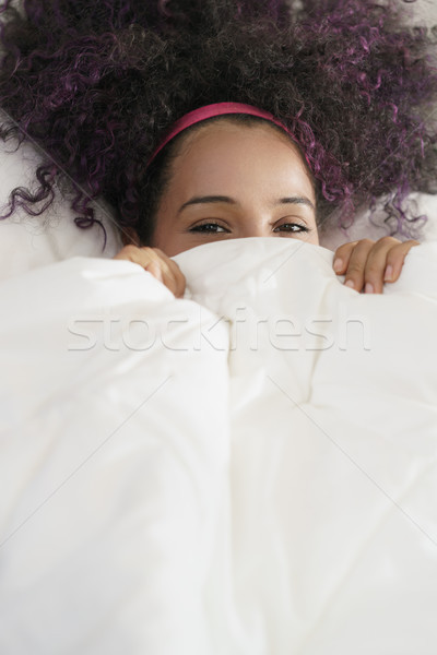 Beautiful Happy Hispanic Teen Waking Up And Smiling Undercover Stock photo © diego_cervo