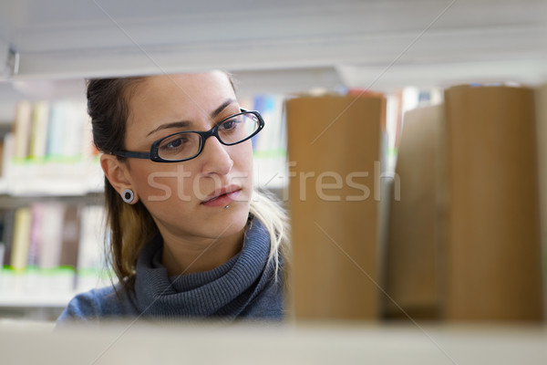 woman choosing book in library Stock photo © diego_cervo