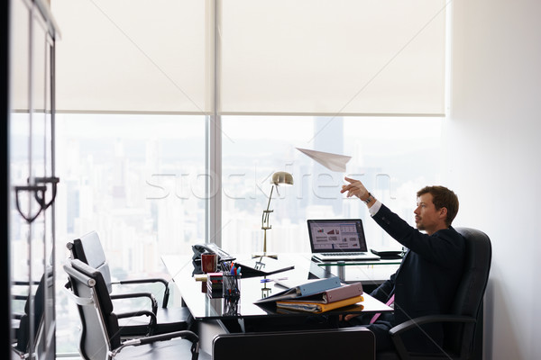 Successful Man Office Worker Daydreaming Throwing Paper Airplane Stock photo © diego_cervo