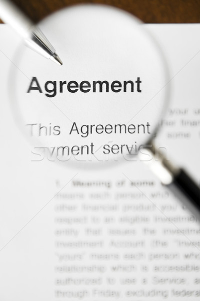 увеличительное стекло соглашение документы пер бизнеса бумаги Сток-фото © diego_cervo