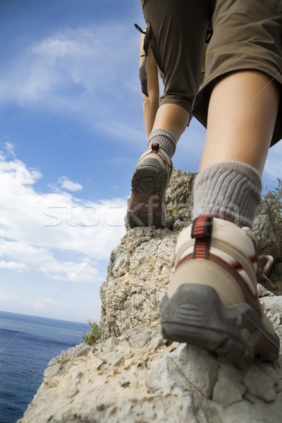 Turystyka młoda kobieta górę górskich niebo sportu Zdjęcia stock © diego_cervo