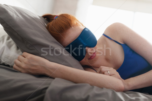 Woman In Bed Sleeping With Sleep Mask On Eyes Stock photo © diego_cervo