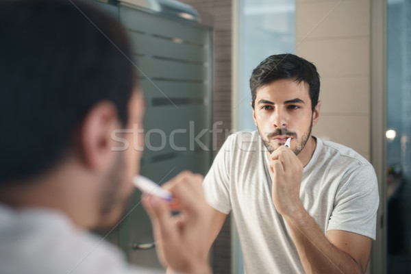 Spanyol férfi fogmosás fürdőszoba reggel személy Stock fotó © diego_cervo