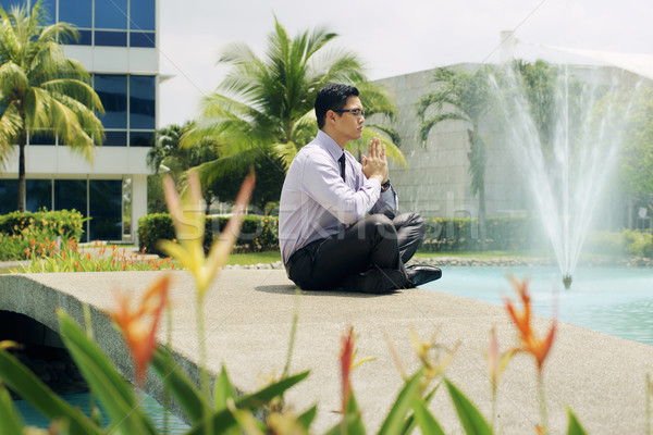 Chinese Business Man Meditate Yoga Outside Office Building Stock photo © diego_cervo