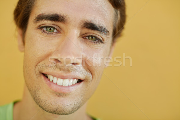 college student looking at camera and smiling Stock photo © diego_cervo