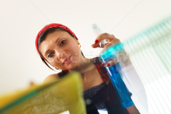 Hispanic Girl Maid At Home Doing Chores Cleaning Glass Table Stock photo © diego_cervo