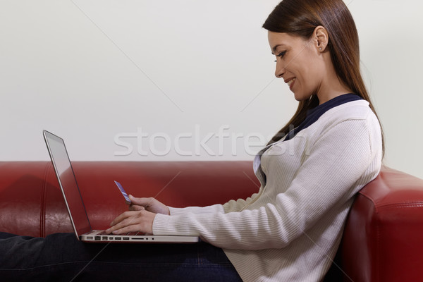 Stock photo: woman with laptop and credit card shopping on internet