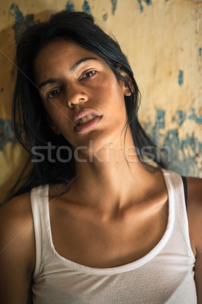 Stock photo: abused and beaten young woman crying at home