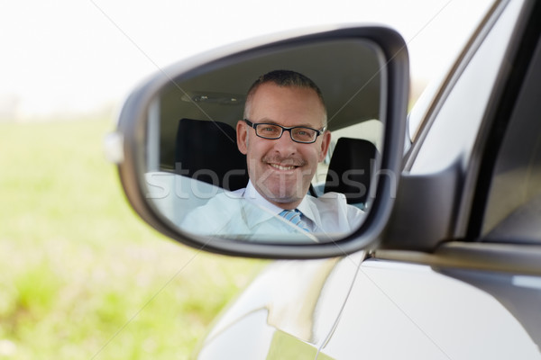 businessman in car smiling at camera Stock photo © diego_cervo