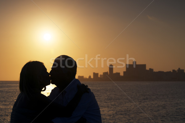 Active retired people, romantic elderly couple in love, kissing  Stock photo © diego_cervo