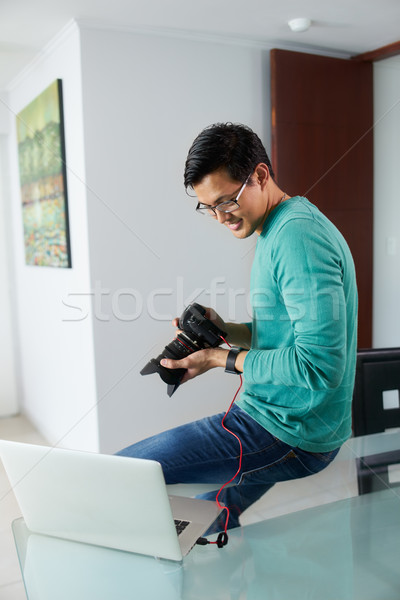 Asian Man Tethering DSLR To Laptop PC Downloading Photo Stock photo © diego_cervo