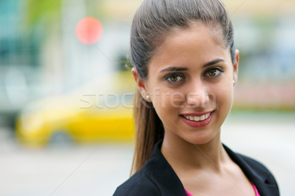 Portrait of business woman on street with cars and traffic light Stock photo © diego_cervo