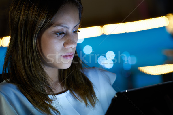 Latina Teenager Using Tablet PC Indoor At Night Stock photo © diego_cervo