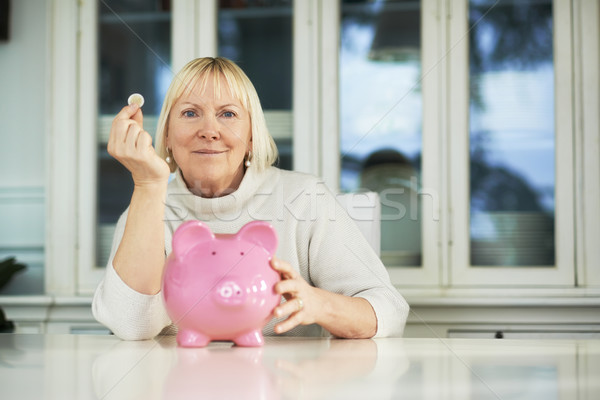 Oude vrouw tonen spaarpot euro munt portret Stockfoto © diego_cervo