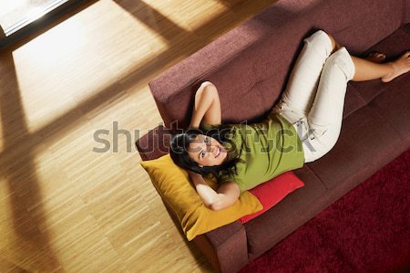 Kobieta snem sofa poziomy Zdjęcia stock © diego_cervo