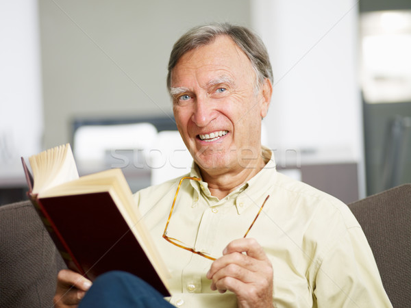 senior man reading book Stock photo © diego_cervo
