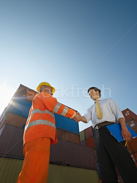 businessman and manual worker with cargo containers Stock photo © diego_cervo