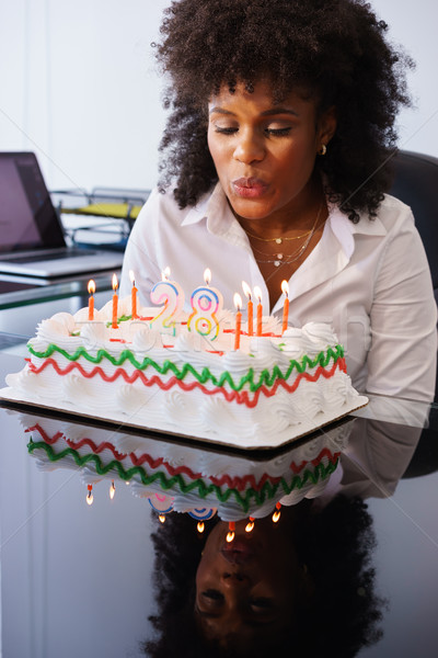 Business Woman Celebrating Birthday Party In Office Blowing Cand Stock photo © diego_cervo