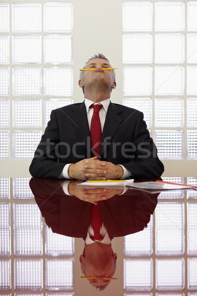 Gelangweilt Mann spielen Bleistift Arbeit frustriert Stock foto © diego_cervo