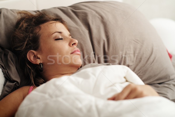 Young Woman Sleeping In Bed On Sunday Morning Stock photo © diego_cervo