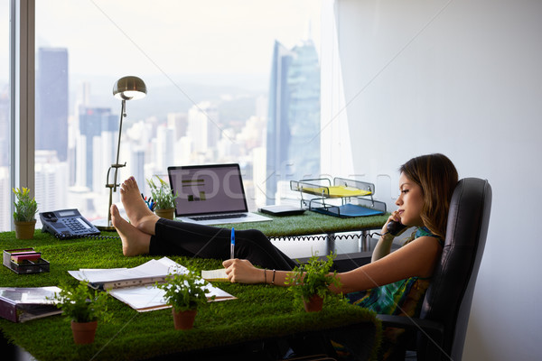 Environmentalist Woman Writes Note Barefeet On Office Desk Stock photo © diego_cervo