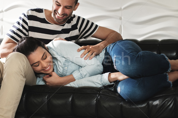 Happy Latino Couple Having Fun And Laughing On Sofa Stock photo © diego_cervo