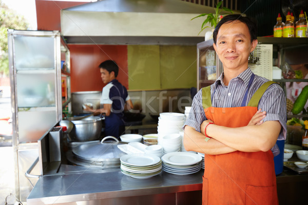 Man werken kok asian restaurant keuken Stockfoto © diego_cervo