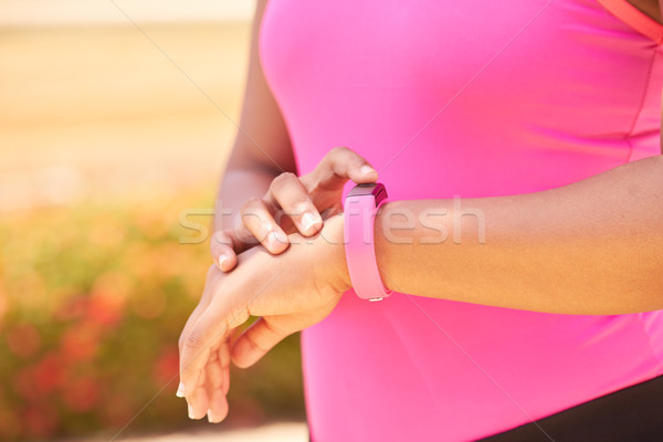 Woman Sports Training Using Fitness Fitwatch Steps Counter Stock photo © diego_cervo