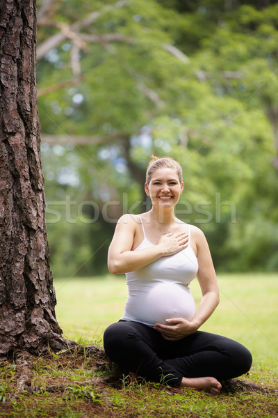 pregnant woman belly yoga meditating tree park Stock photo © diego_cervo